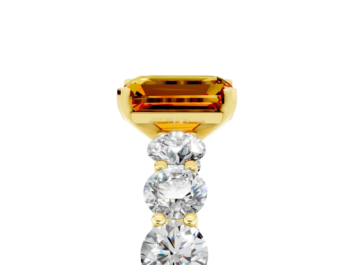 Emerald Cut Citrine Prong Setting with Side Stones on a Pave Band Yellow gold