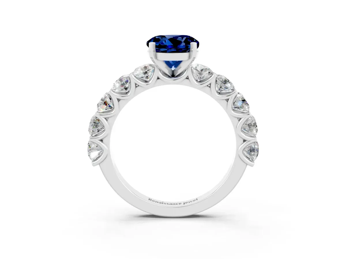 Round Cut Blue Sapphire Prong Setting with Side Stones on a Pave Band Platinum