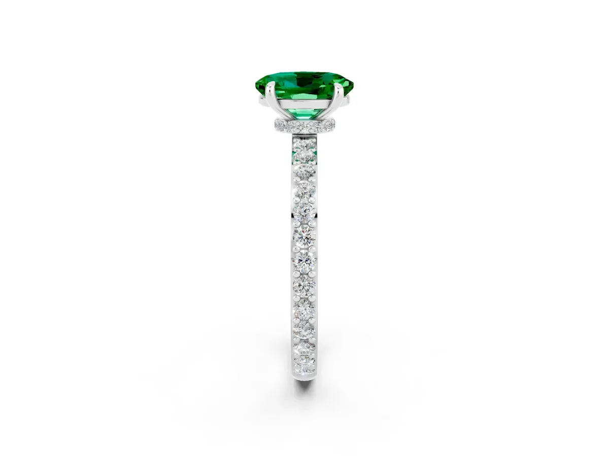 Oval Cut Emerald Solitaire Engagement Ring with Pavé Band and Four-Prong Setting Silver