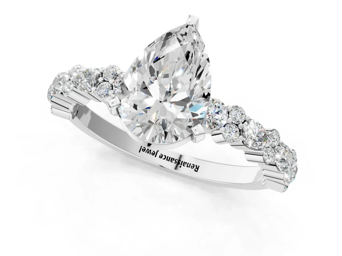 Pear Cut Diamond Side Stone Solitaire Ring with Round Moissanite and Four-Prong Setting White gold