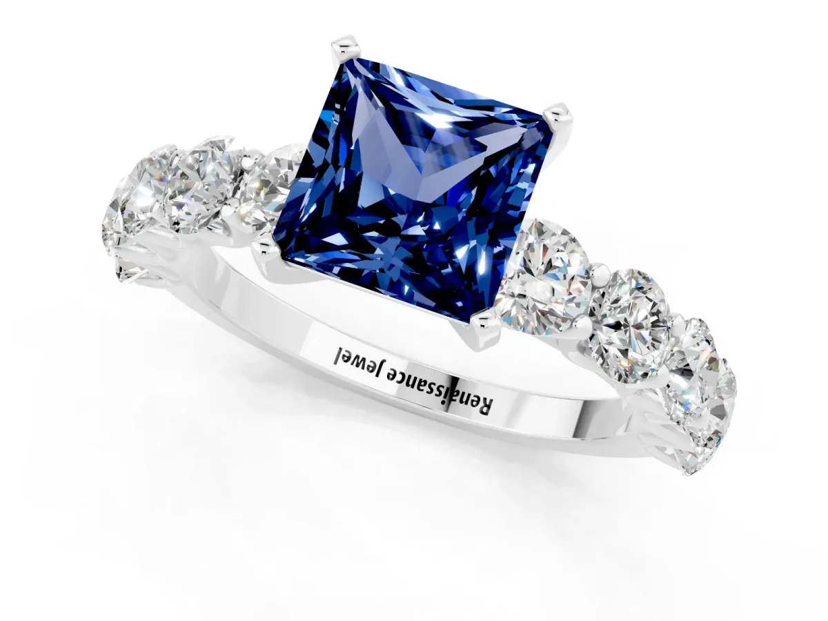 Princess Cut Blue Sapphire Prong Setting with Side Stones on a Pave Band Silver