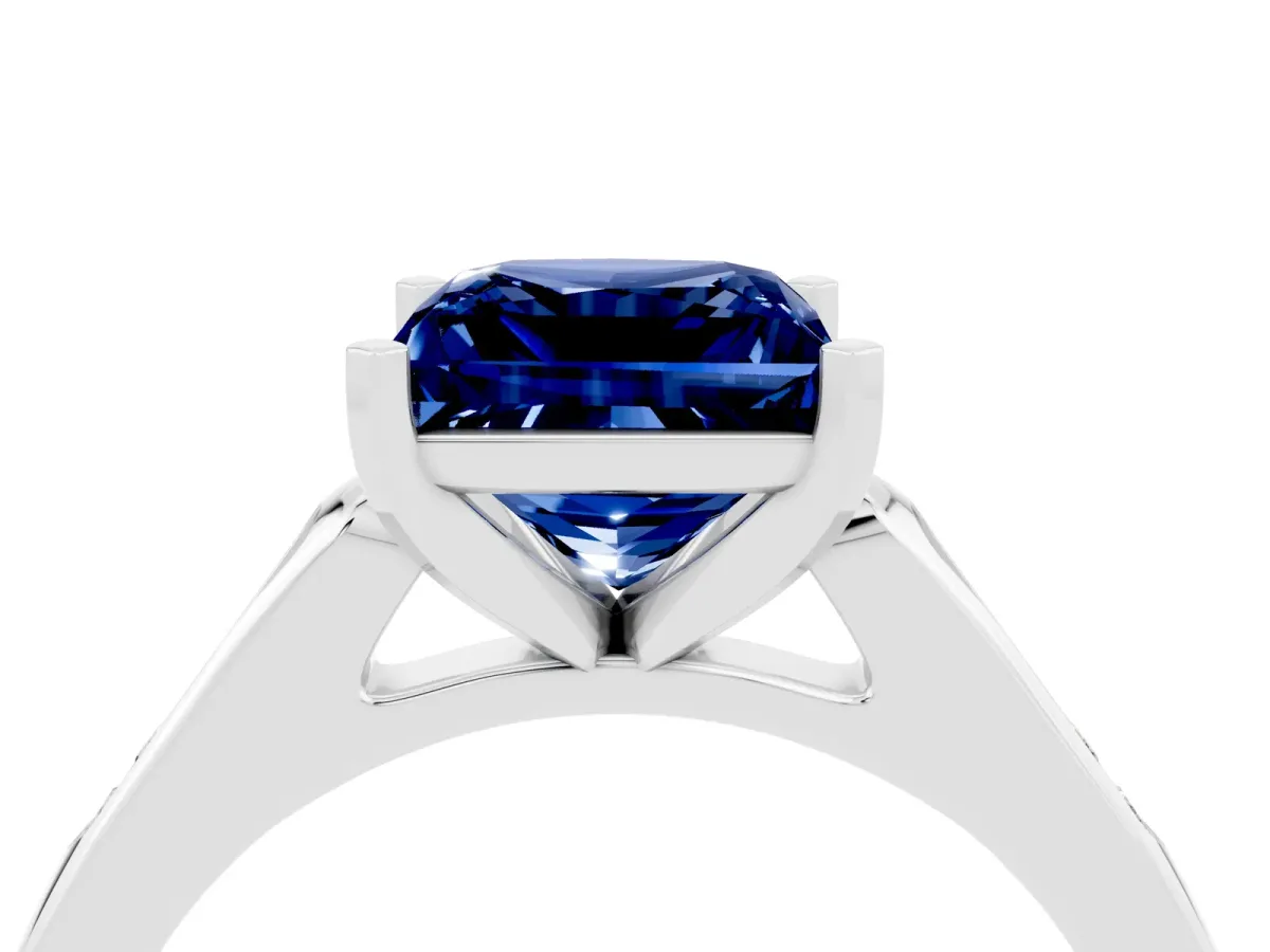 Princess Cut Blue Sapphire Solitaire Ring with Channel Set Round Band and Prong Setting Silver