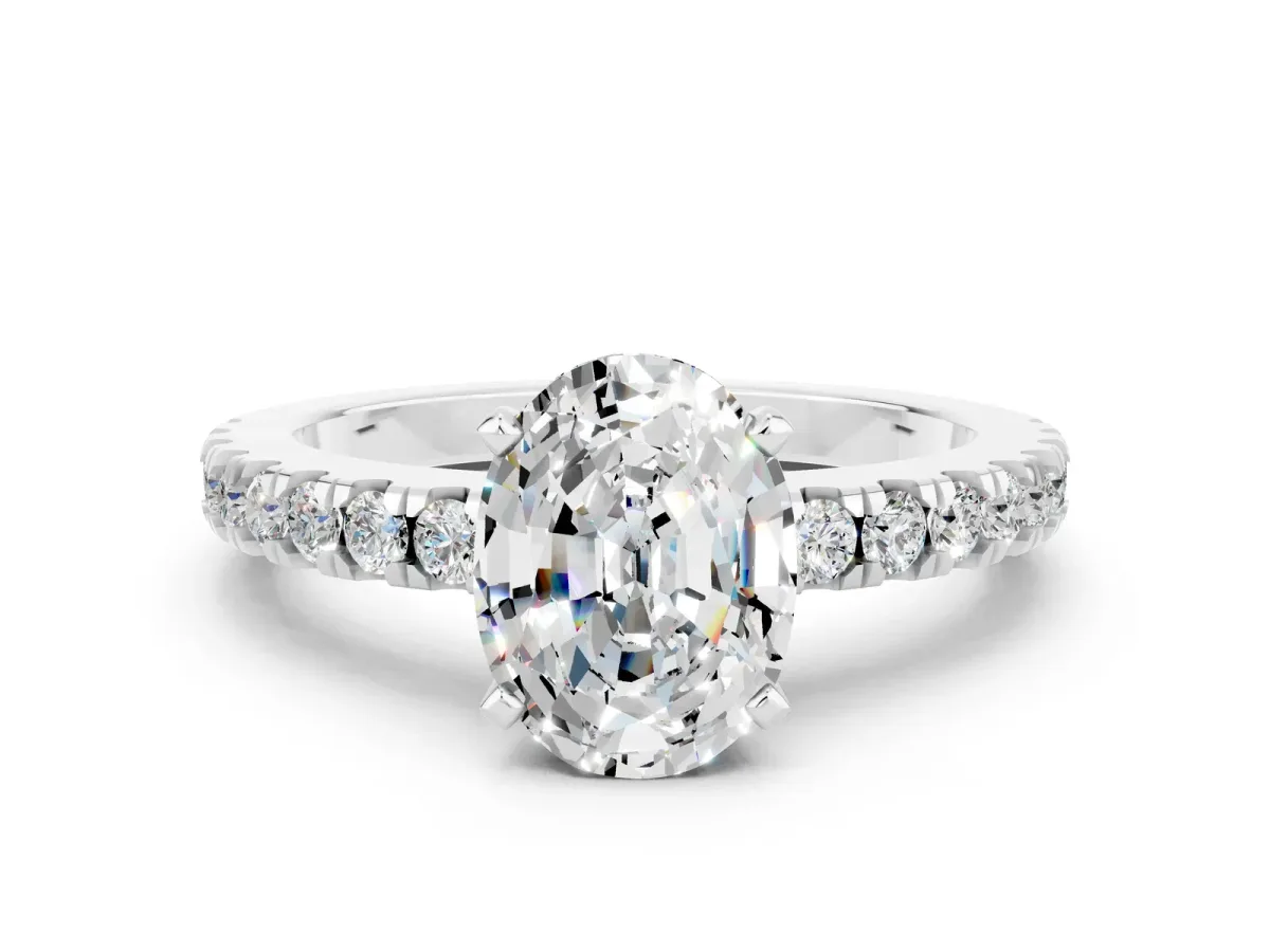 Oval Cut Solitaire Moissanite with Pavé Band and Four-Prong Setting Silver