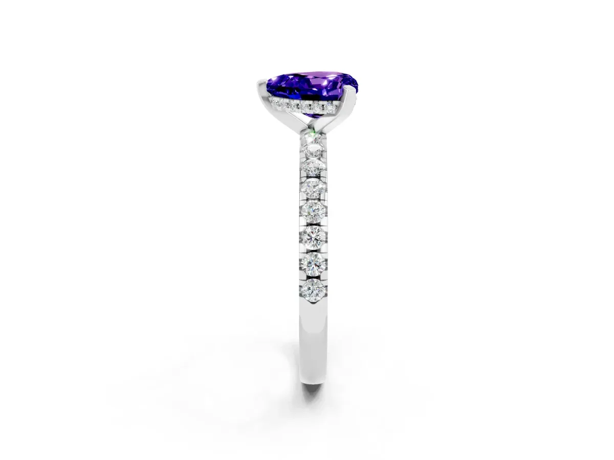 Heart Cut Tanzanite Solitaire Ring with Round Pavé Band and Four-Prong Setting Silver