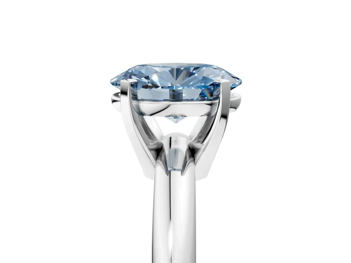 Fancy Blue Oval Cut Diamond Solitaire Engagement Ring with Round Band and Four-Prong Setting Silver