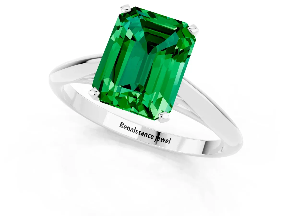 Emerald Cut Emerald Solitaire Engagement Ring with Cathedral Setting and Four-Prong Mount White gold