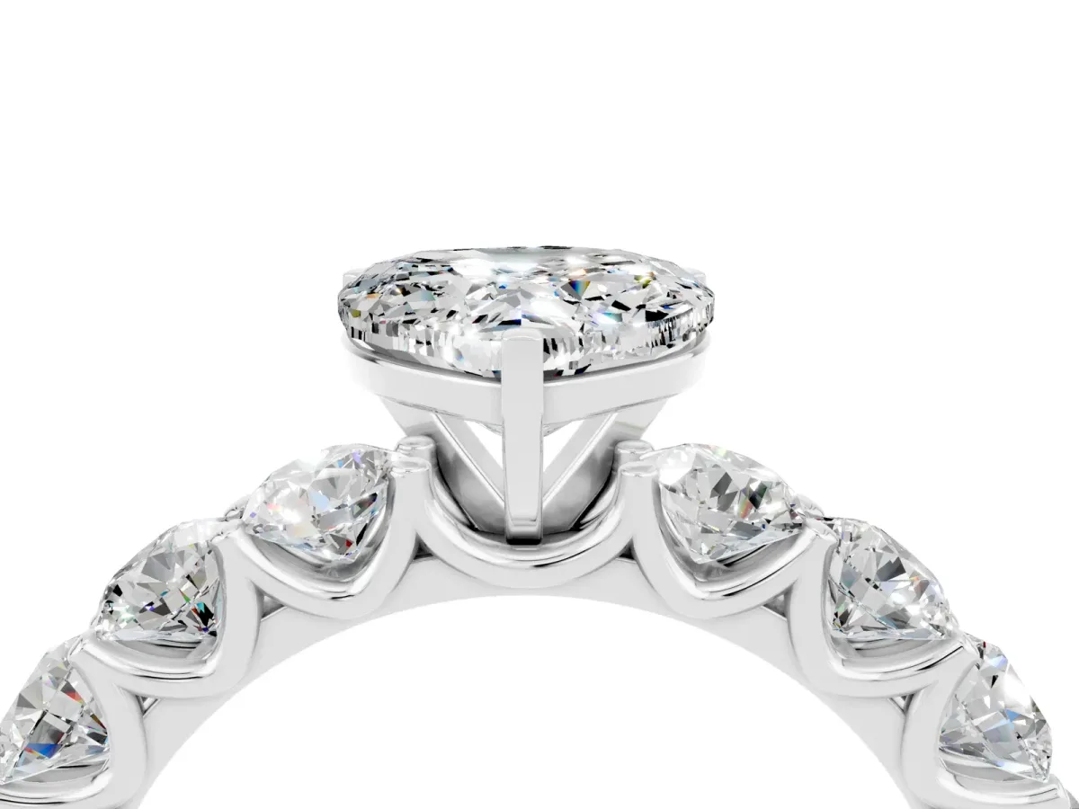 Heart Cut Moissanite Prong Setting with Side Stones on a Pave Band Silver