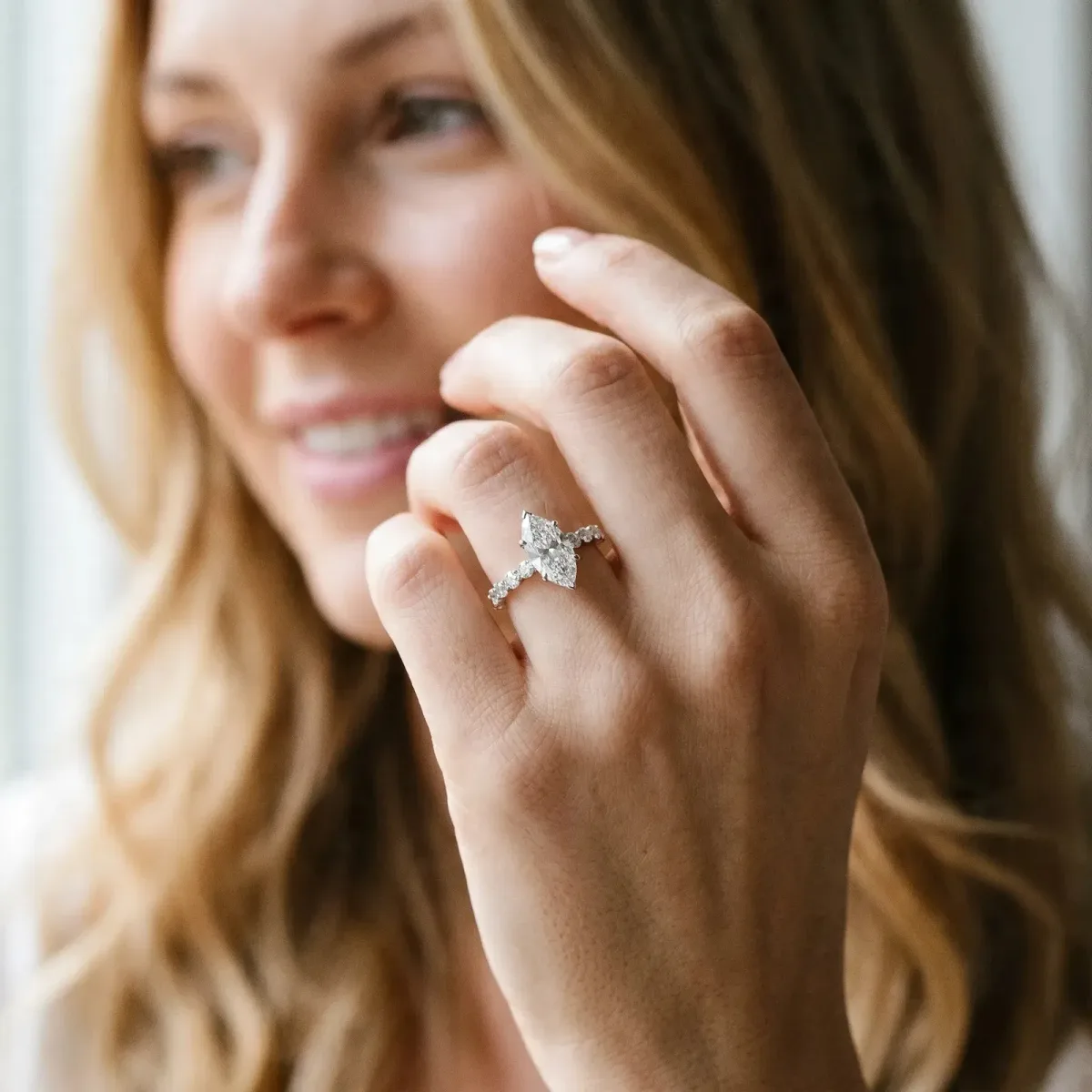 Marquise Cut Solitaire Diamond Ring with Pave Band and Four-Prong Setting Silver