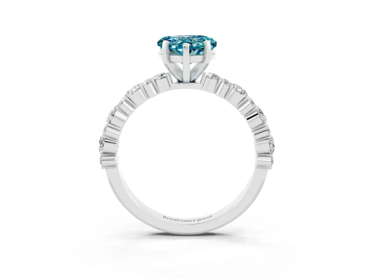Heart Cut Blue Topaz Side Stone Solitaire Ring with Round and Four-Prong Setting Silver
