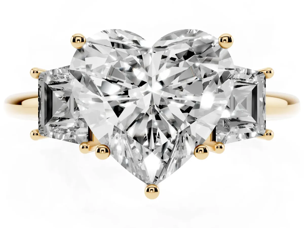 Heart Cut Diamond Three-Stone Ring with Trapezoid Side Stones and Prong Setting Yellow gold