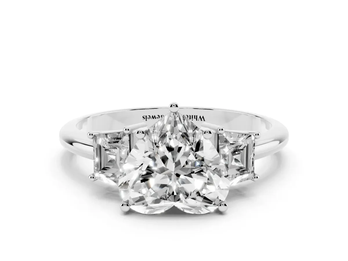 Heart Cut Diamond Three-Stone Ring with Trapezoid Side Stones and Prong Setting Platinum