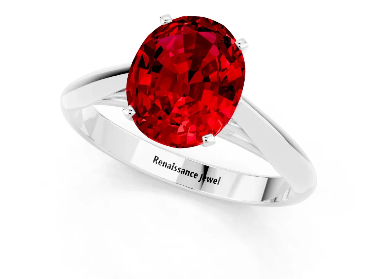 Oval Cut Ruby Solitaire Engagement Ring with Cathedral Setting and Four-Prong Mount White gold