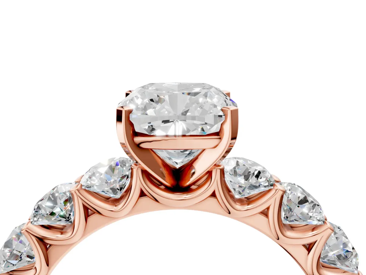 Cushion Cut Diamond Prong Setting with Side Stones on a Pave Band Rose gold