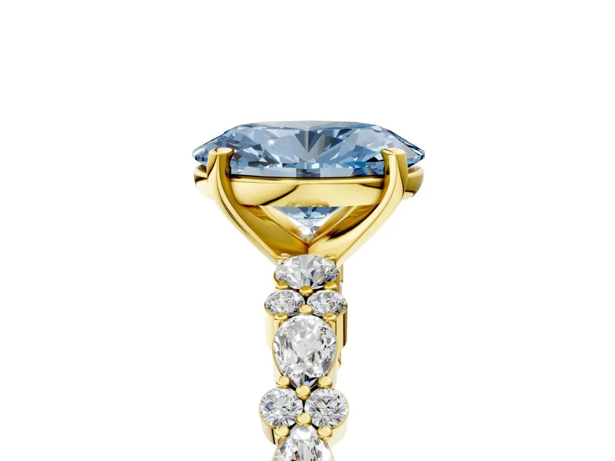 Fancy Blue Oval Cut Diamond Side Stone Solitaire Ring with Round and Four-Prong Setting Yellow gold