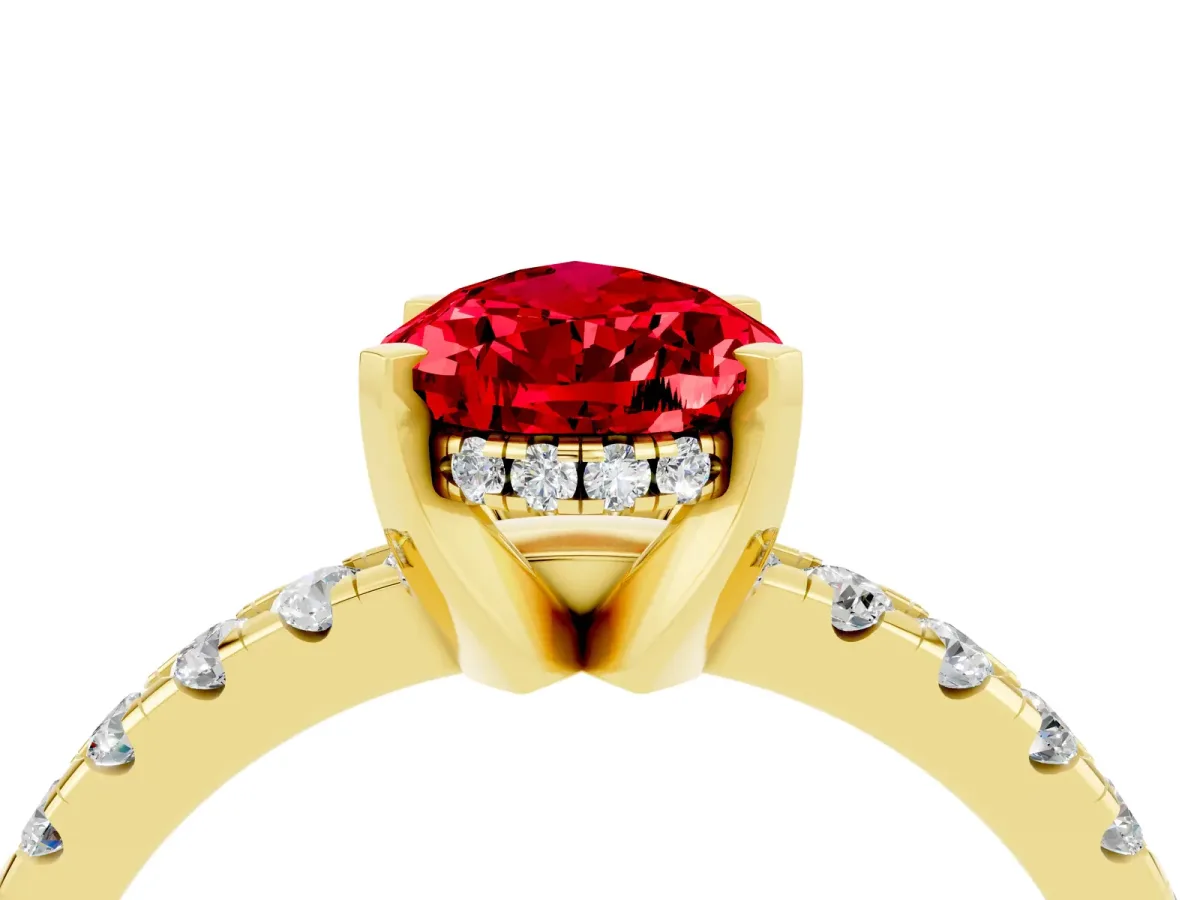 Pear Cut Ruby Solitaire Ring with Round Pavé Band and Four-Prong Setting Yellow gold