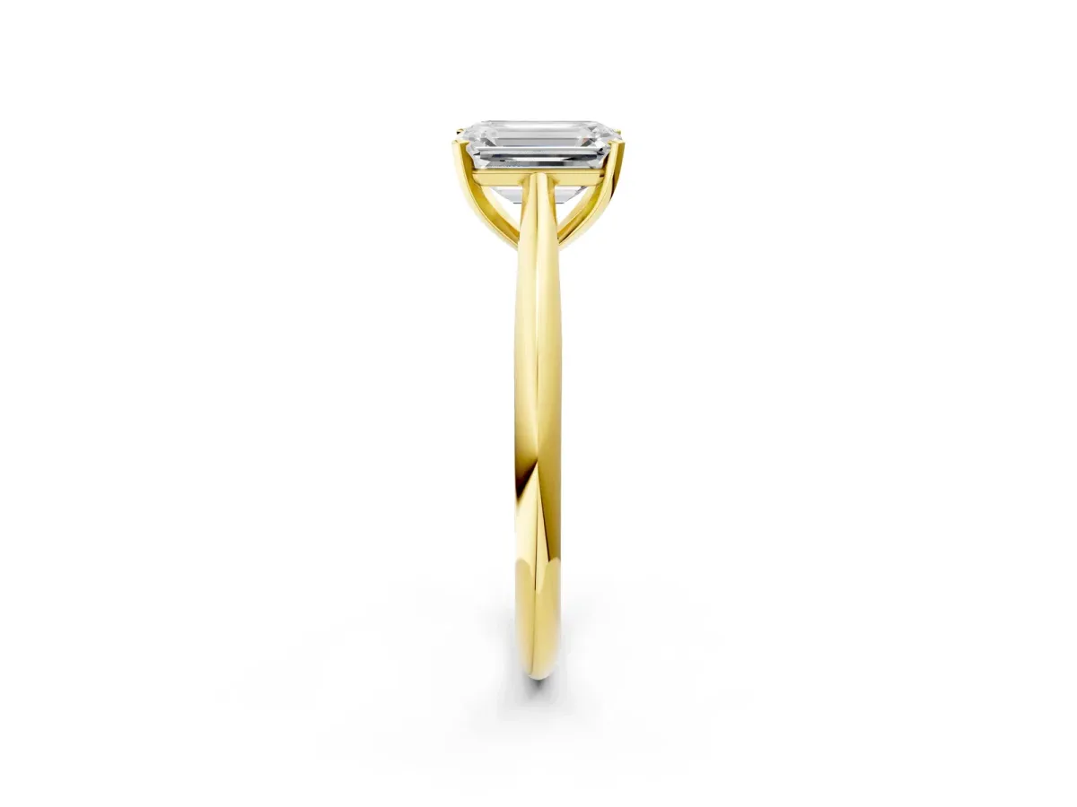 Emerald Cut Diamond Solitaire Engagement Ring with Cathedral Setting and Four-Prong Mount Yellow gold