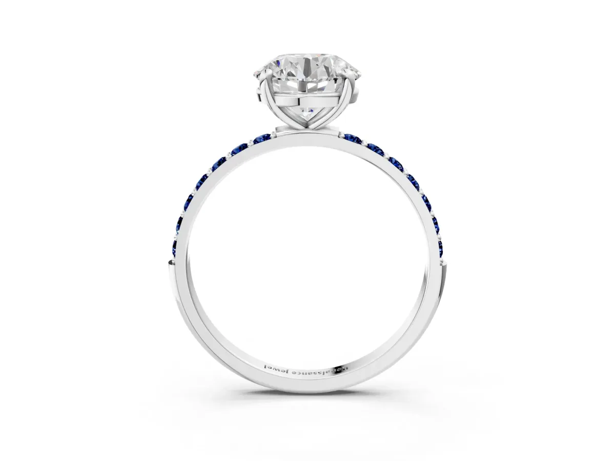 Round Cut Diamond Solitaire Ring with Round Blue Sapphire Pavé Band and Prong Setting Silver