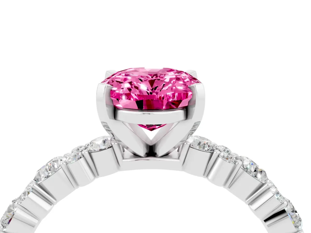 Oval Cut Pink Sapphire Side Stone Solitaire Ring with Round and Four-Prong Setting White gold