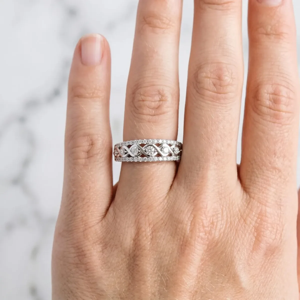 Round Brilliant Diamond Infinity Twist Pave Band with Prong Setting Platinum