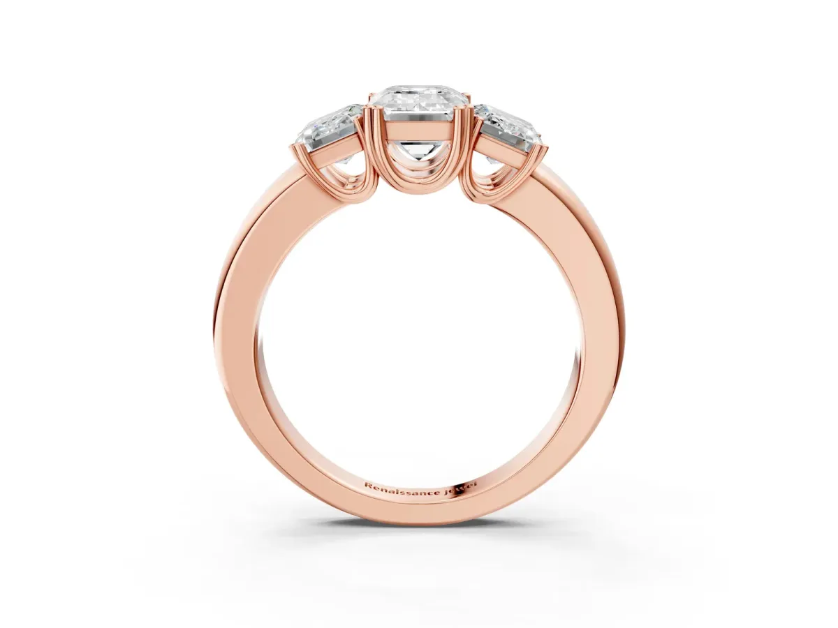 Three-Stone Emerald Cut Cut Diamond Ring with Channel Set Band and Four-Prong Setting Rose gold