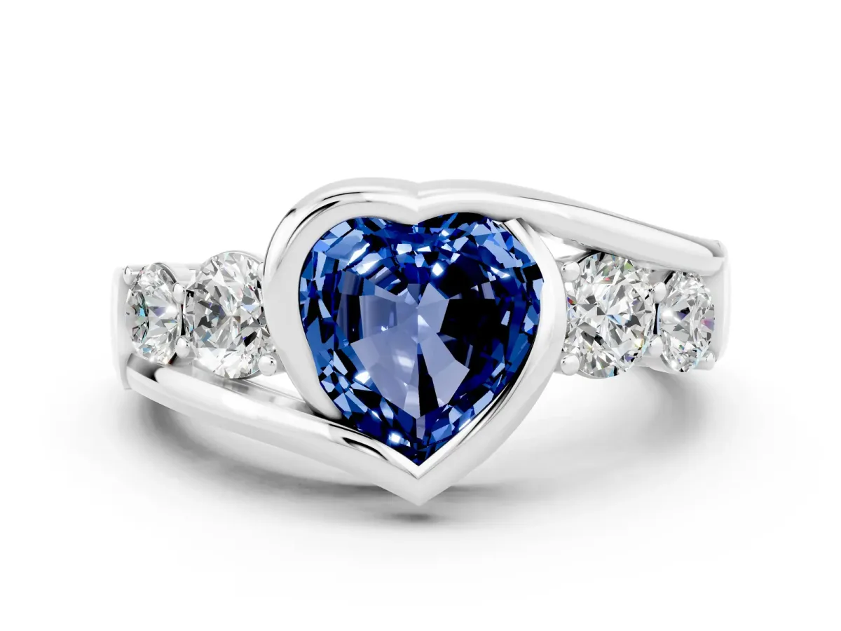 Bezel Set Heart Cut Blue Sapphire Bypass Ring with Round Accents Silver
