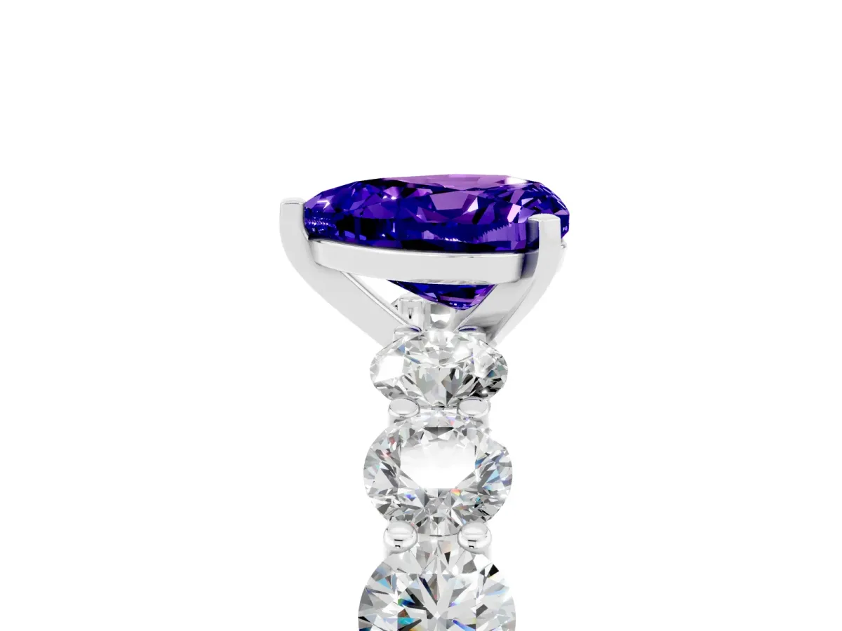 Heart Cut Tanzanite Prong Setting with Side Stones on a Pave Band Silver