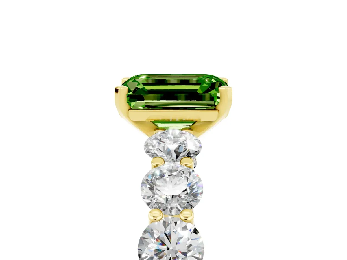 Emerald Cut Peridot Prong Setting with Side Stones on a Pave Band Yellow gold