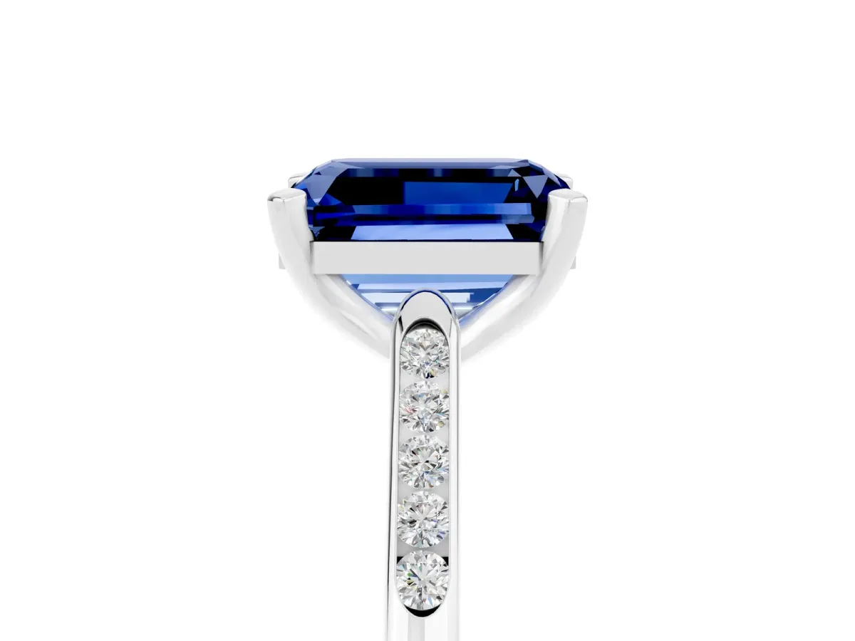 Emerald Cut Blue Sapphire Solitaire Ring with Channel Set Round Band and Prong Setting Silver
