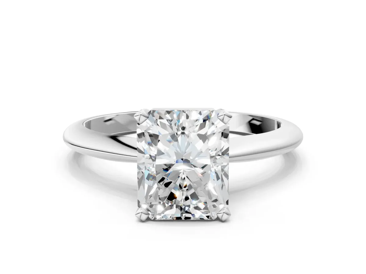 Radiant Cut Cut Solitaire Ring with Four-Prong Setting on a Classic Band Platinum