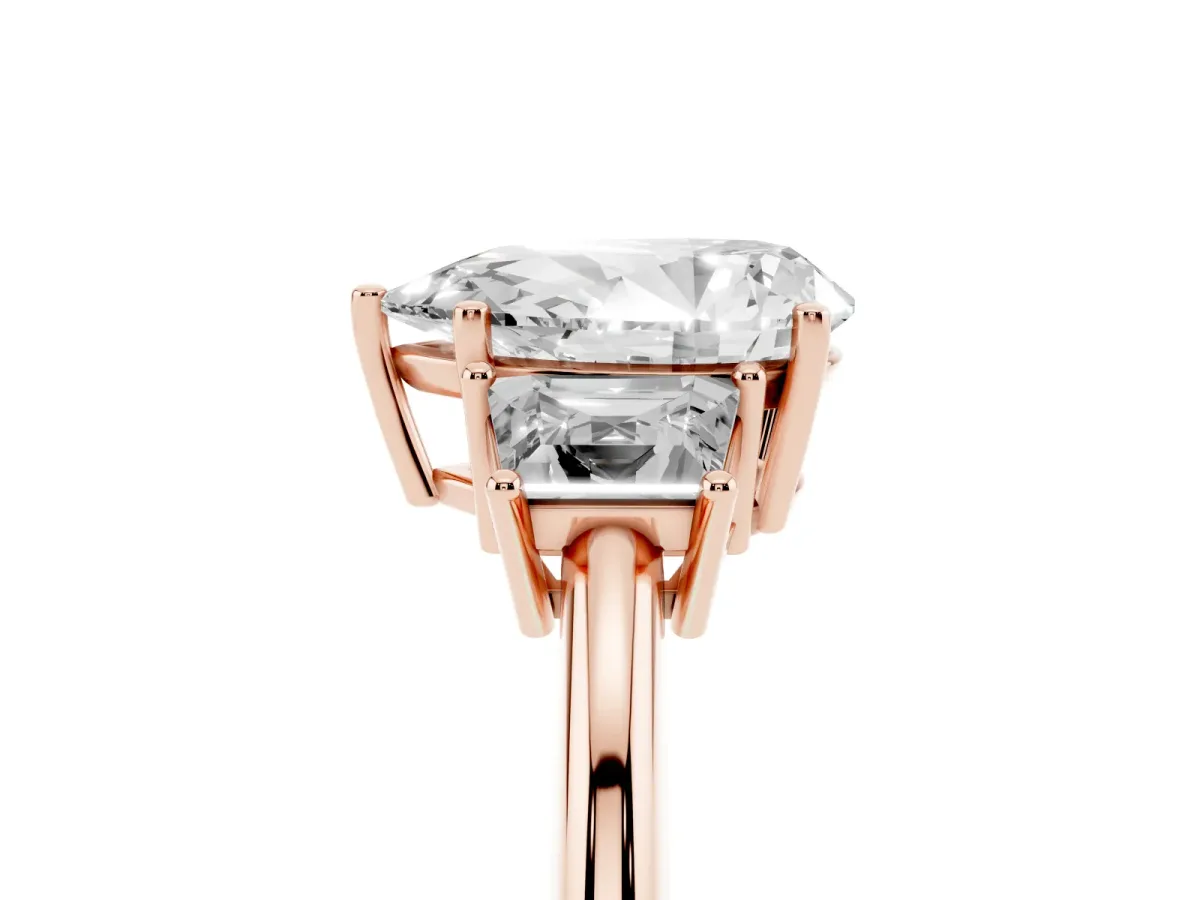 Pear Cut Diamond Three-Stone Ring with Trapezoid Side Stones and Prong Setting Rose gold