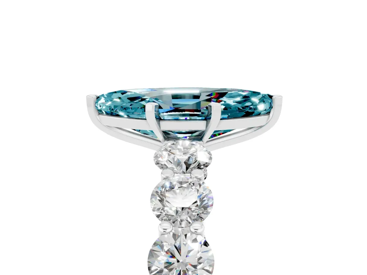 Marquise Cut Blue Topaz Prong Setting with Side Stones on a Pave Band Silver
