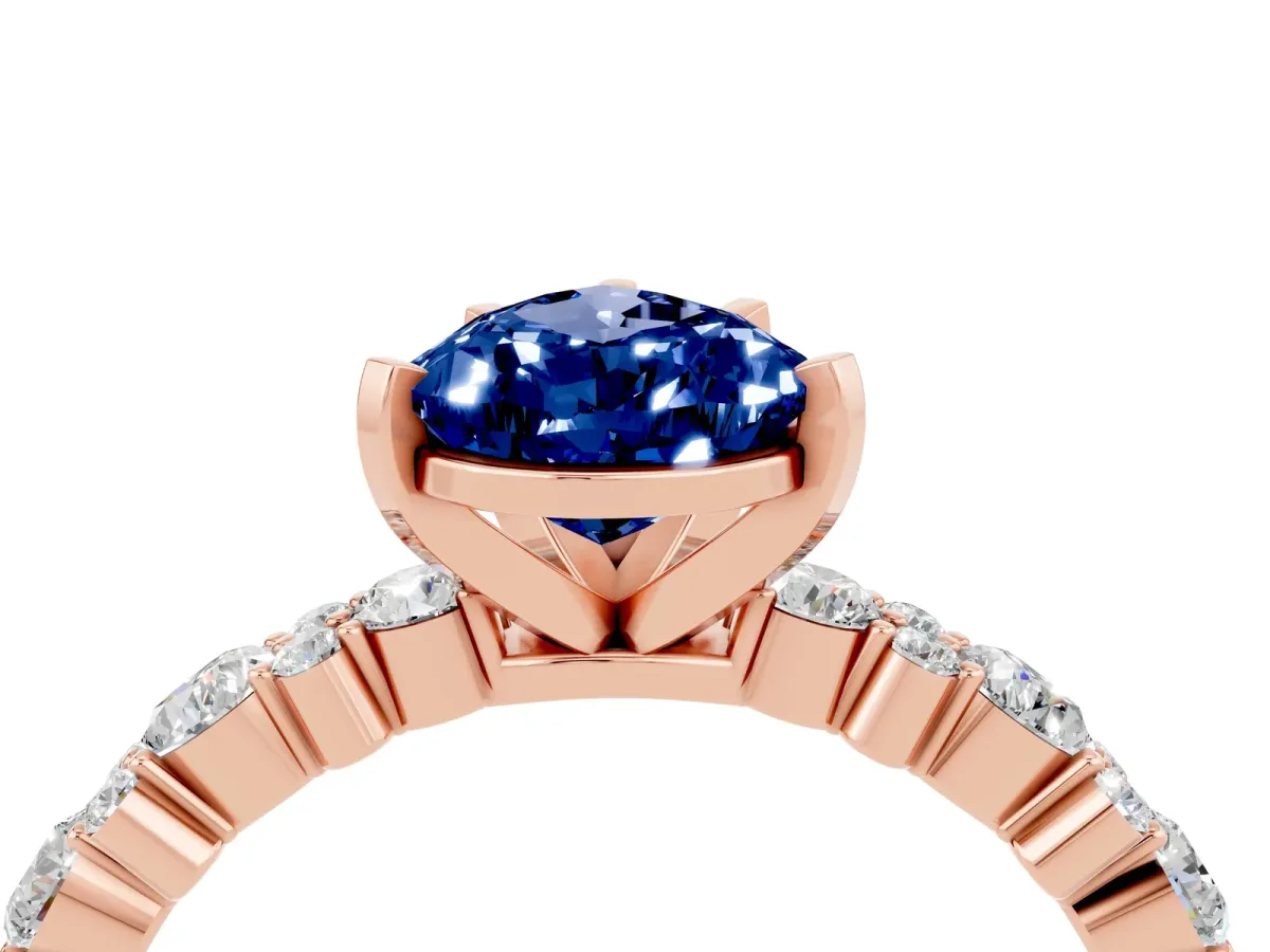 Pear Cut Blue Sapphire Side Stone Solitaire Ring with Round and Four-Prong Setting Rose gold