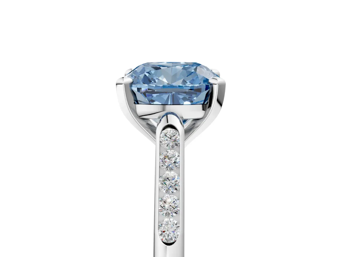 Fancy Blue Cushion Cut Diamond Solitaire Ring with Channel Set Round Band and Prong Setting Silver