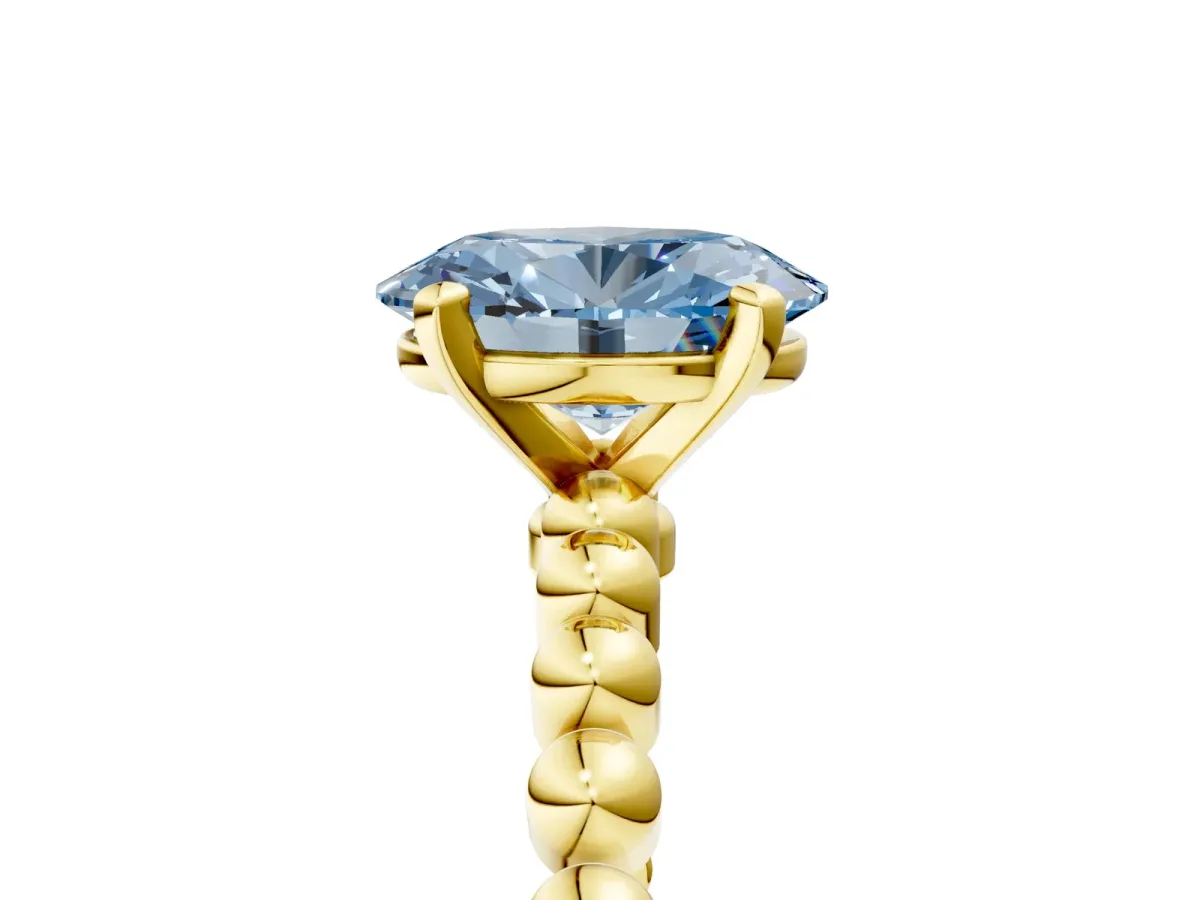 Fancy Blue Oval Cut Diamond Solitaire Ring with Beaded Band and Prong Setting Yellow gold