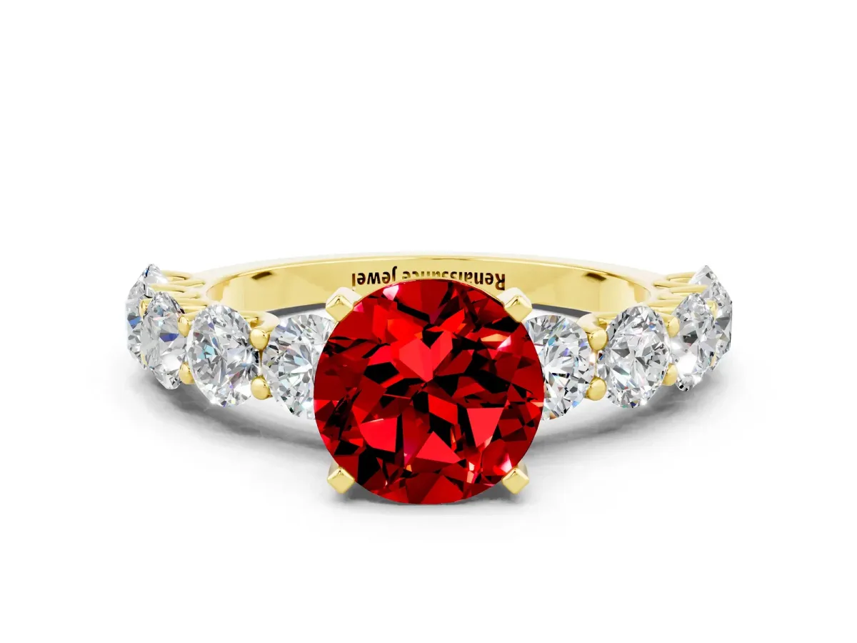 Round Cut Ruby Prong Setting with Side Stones on a Pave Band Yellow gold