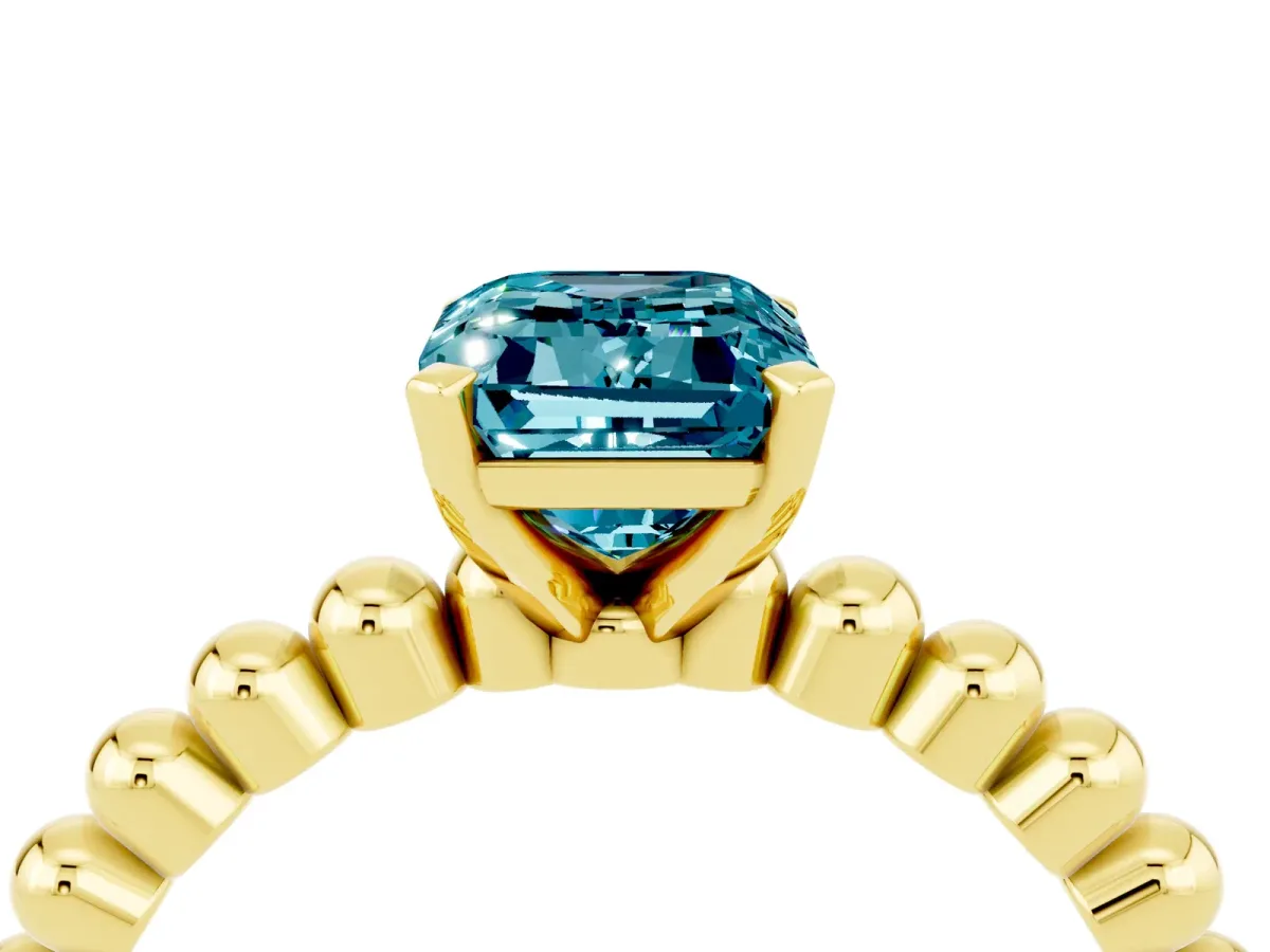 Emerald Cut Blue Topaz Solitaire Ring with Beaded Band and Prong Setting Yellow gold