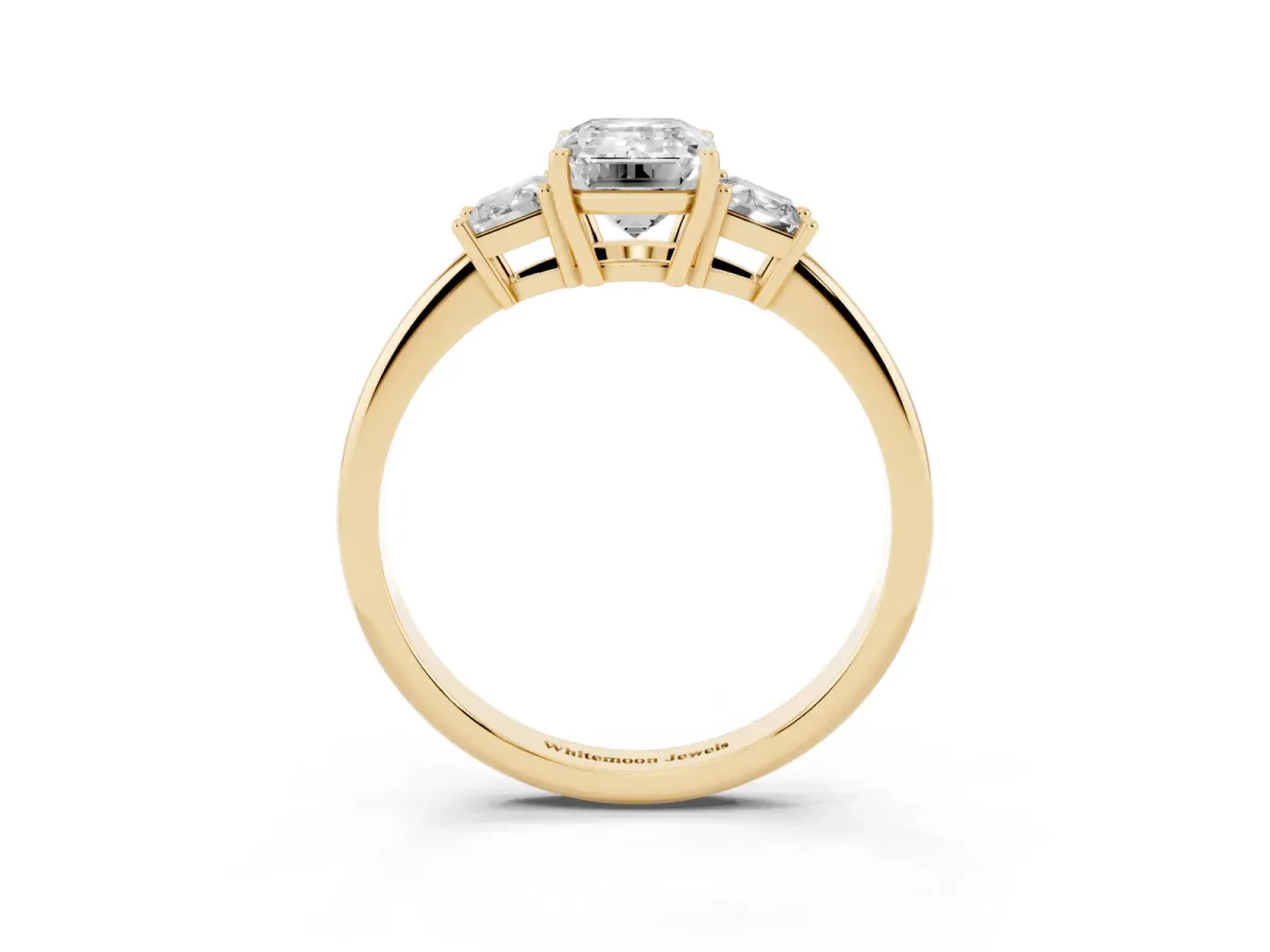 Emerald Cut Diamond Three-Stone Ring with Trapezoid Side Stones and Prong Setting Yellow gold