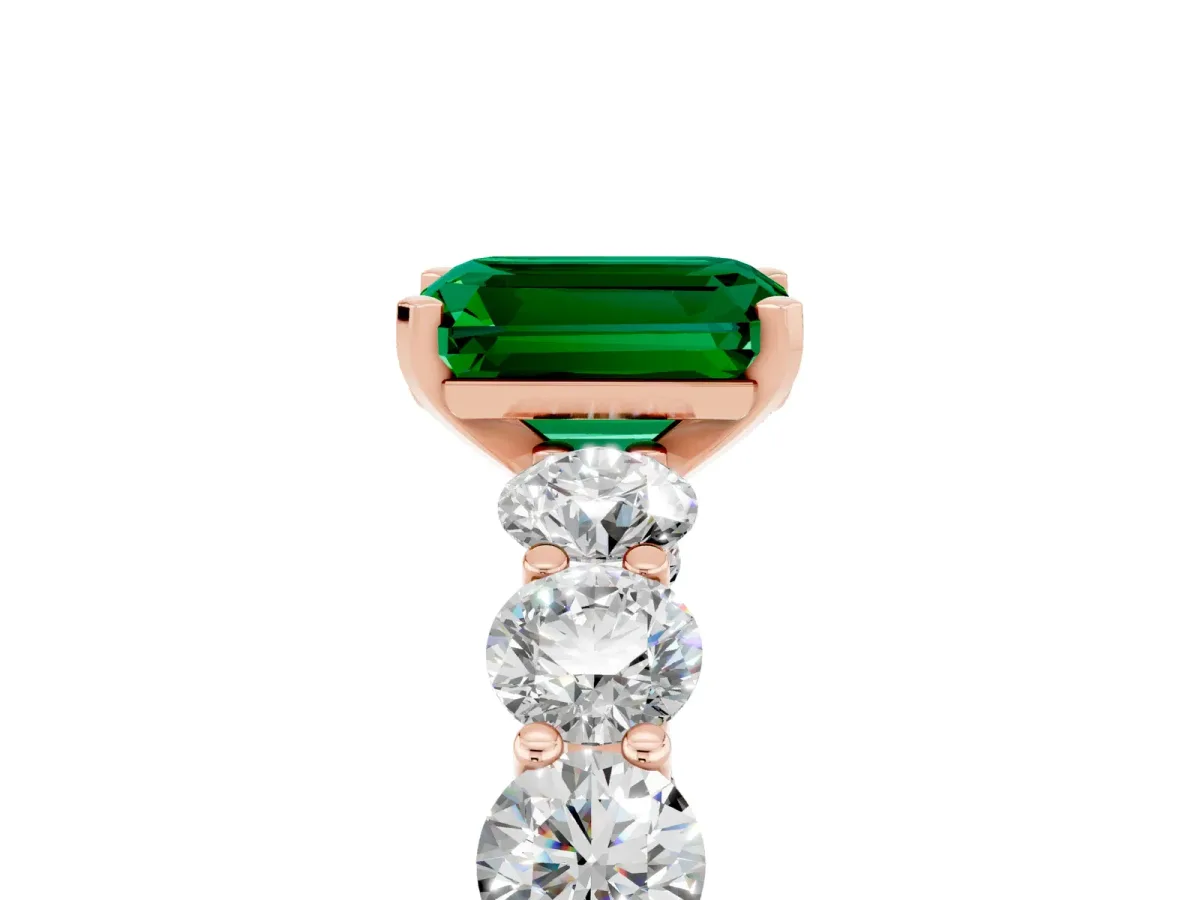 Emerald Cut Emerald Prong Setting with Side Stones on a Pave Band Rose gold