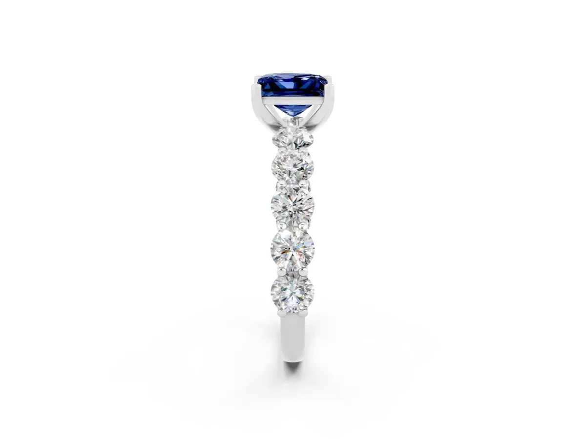 Princess Cut Blue Sapphire Prong Setting with Side Stones on a Pave Band Silver