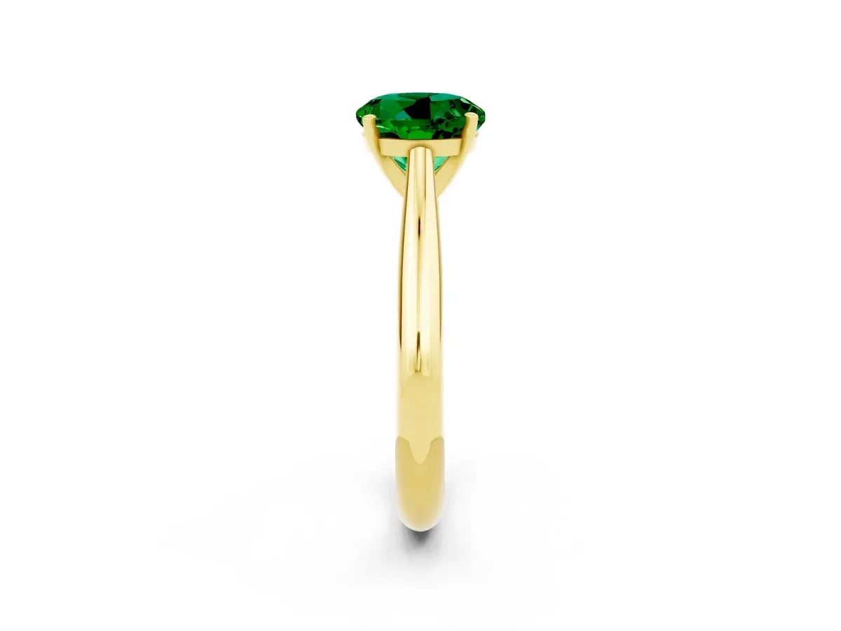 Round Cut Emerald Solitaire Engagement Ring with Cathedral Setting and Four-Prong Mount Yellow gold