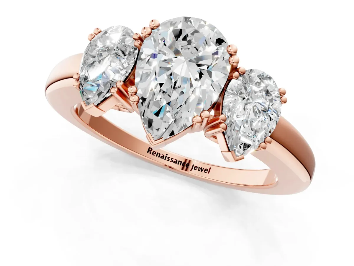Three-Stone Pear Cut Cut Diamond Ring with Channel Set Band and Four-Prong Setting Rose gold