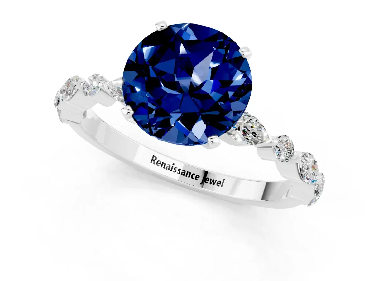 Round Cut Blue Sapphire Ring with Marquise and Round Side Stones and Four-Prong Setting Silver