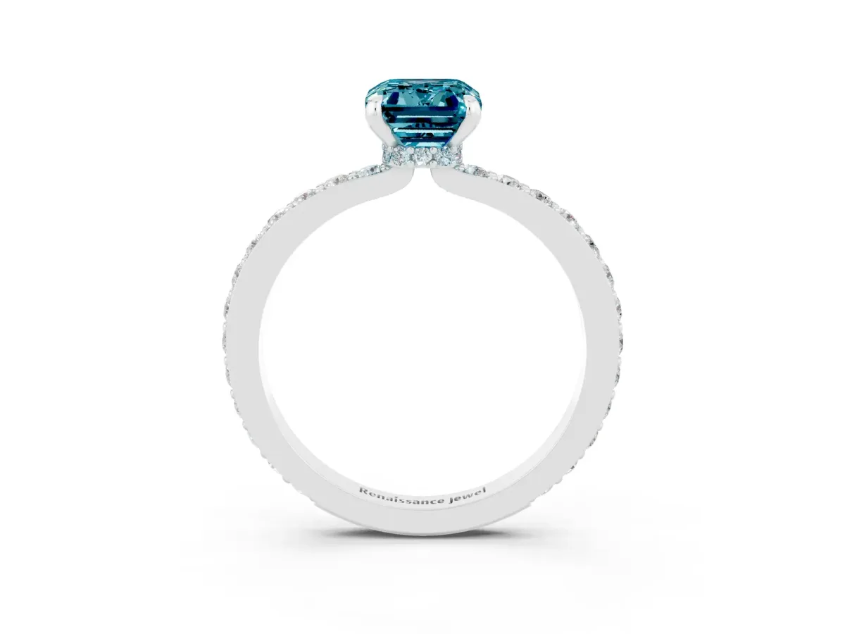 Emerald Cut Blue Topaz Solitaire Engagement Ring with Pavé Band and Four-Prong Setting Silver