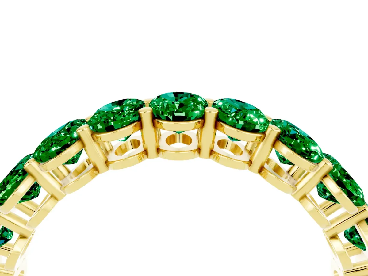 Oval Cut Emerald Eternity Band with Shared Prong Setting Yellow gold