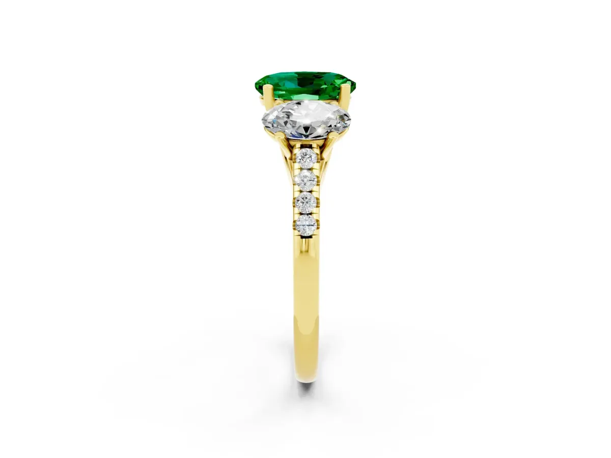 Three-Stone Oval Cut Emerald Ring with Round Pavé Band and Prong Setting Yellow gold