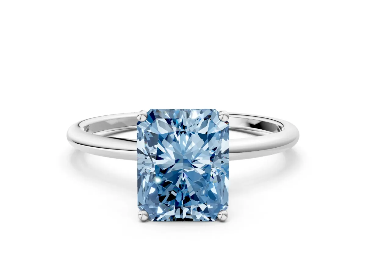 Fancy Blue Radiant Cut Cut Solitaire Engagement Ring with Thin Band and Four-Prong Setting Platinum