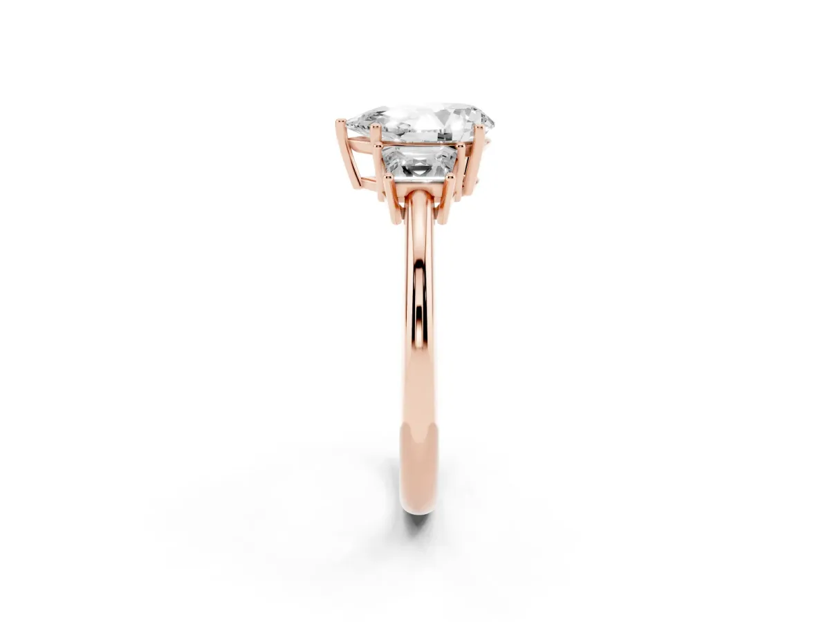 Pear Cut Diamond Three-Stone Ring with Trapezoid Side Stones and Prong Setting Rose gold
