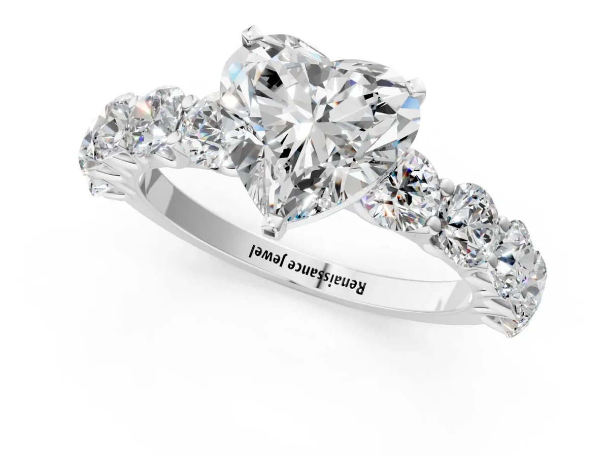 Heart Cut Diamond Prong Setting with Side Stones on a Pave Band Platinum