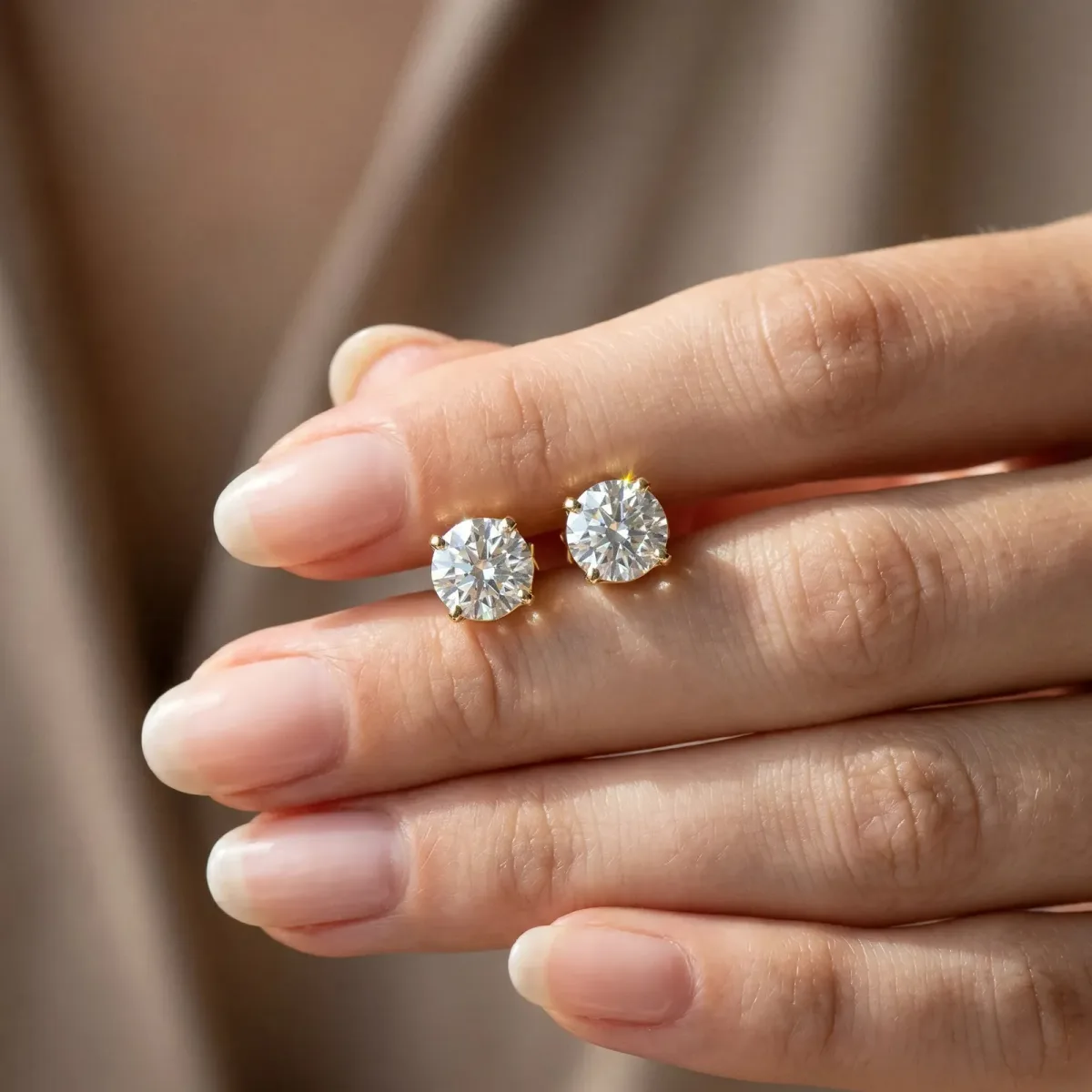 Round Solitaire Diamond Stud Earrings with Four-Prong Basket Setting Yellow gold