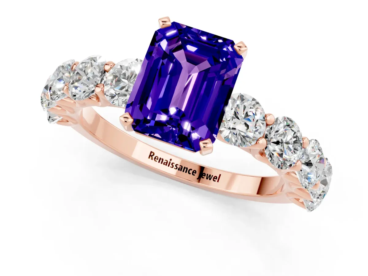 Emerald Cut Tanzanite Prong Setting with Side Stones on a Pave Band Rose gold